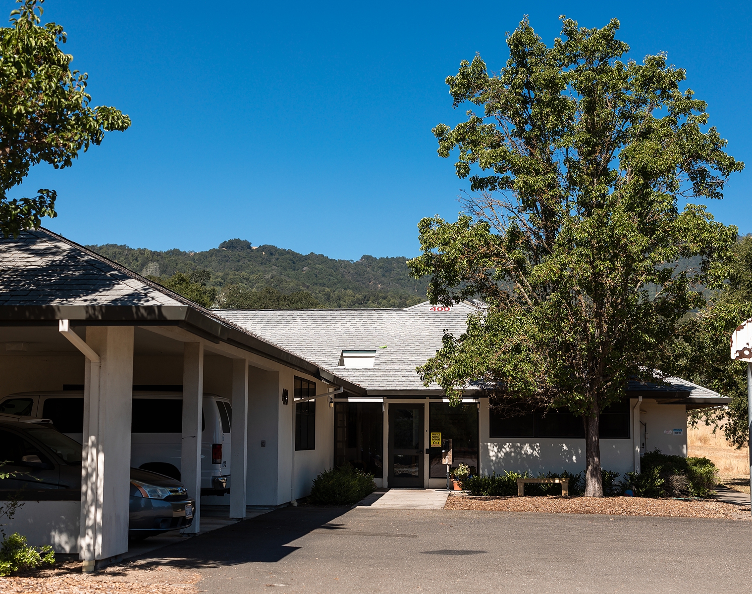 Exterior view of a Hanna Academy campus building with mountains in the background.