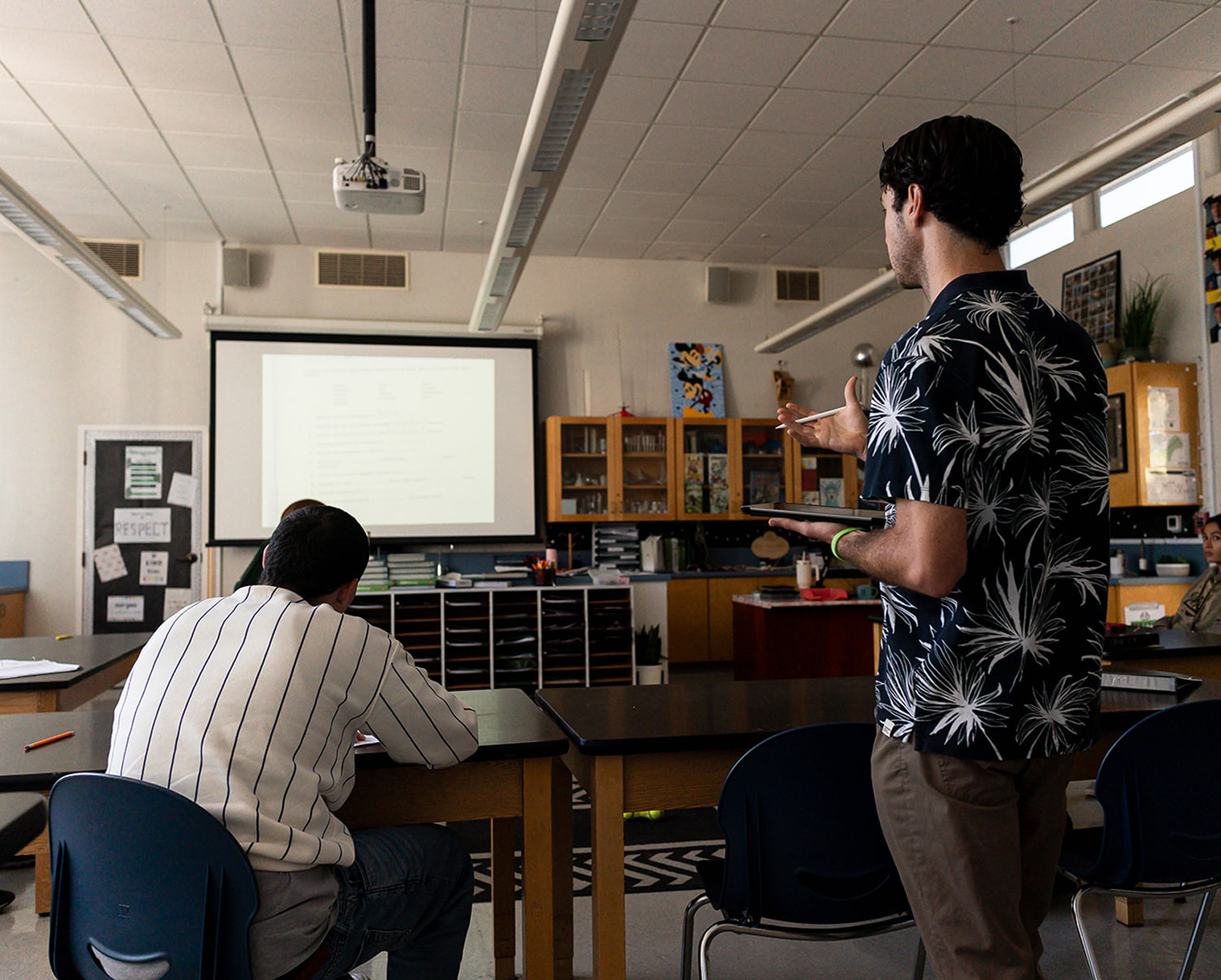 Teacher giving a classroom presentation to students at Hanna Academy.