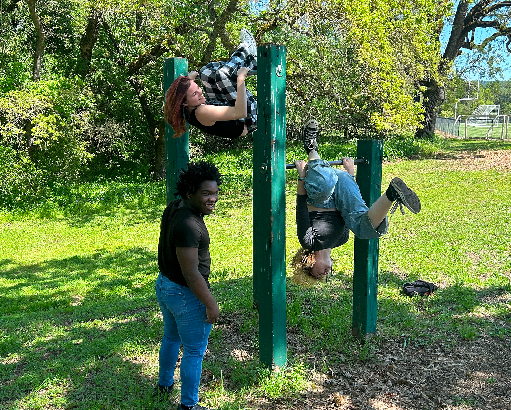 Students working together on an outdoor climbing activity.