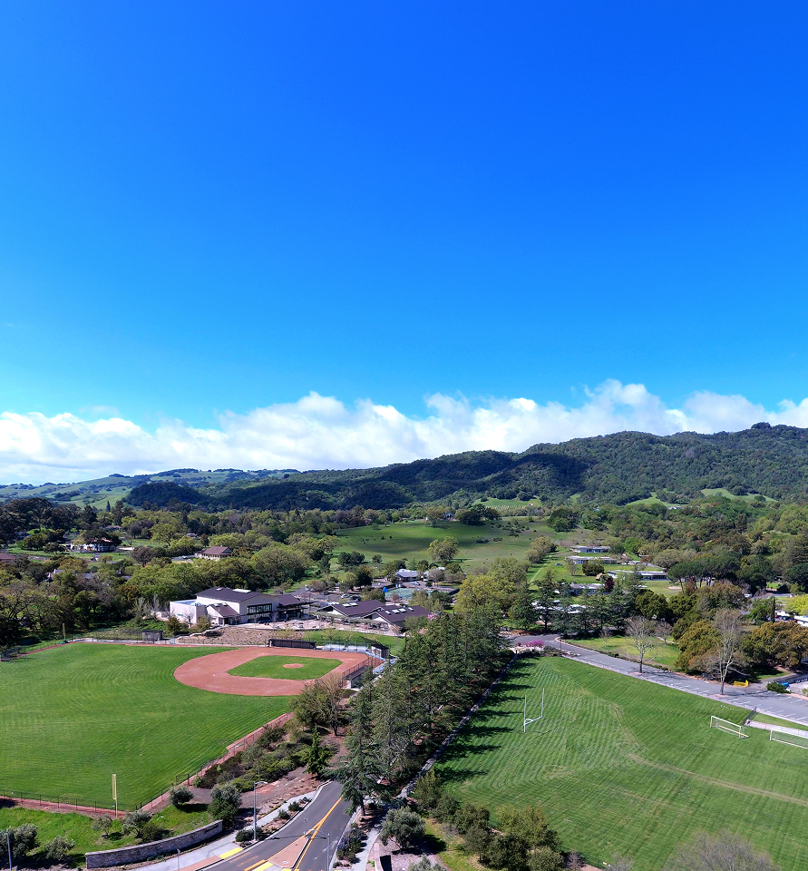 Landscape aerial showing fields and campus infrastructure.