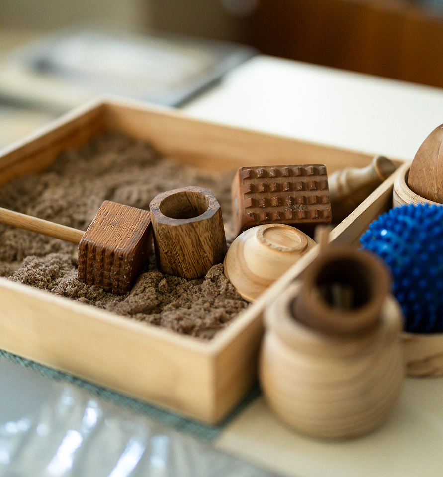 Arts and craft materials on table used in classroom projects.