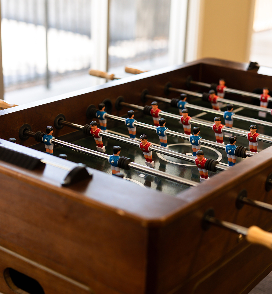 Foosball table game in student common area.