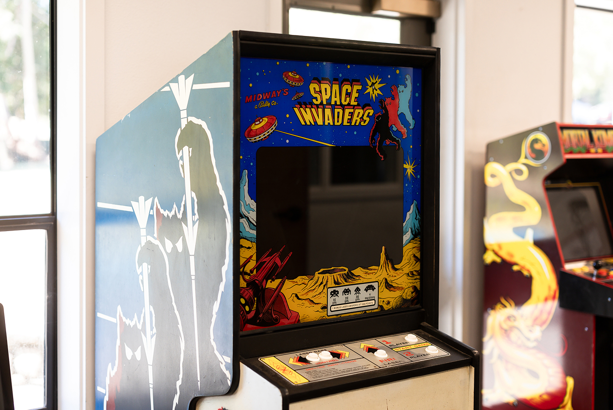 Retro arcade game setup in student common area.